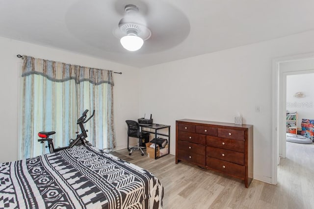 bedroom with ceiling fan and light wood-type flooring