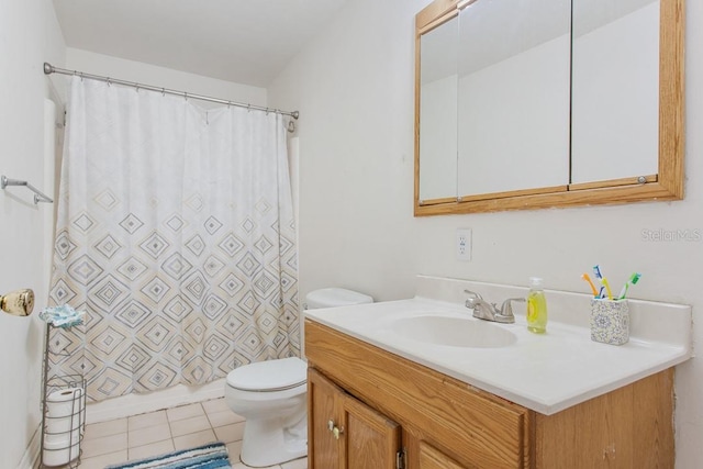 bathroom featuring vanity, walk in shower, toilet, and tile patterned flooring