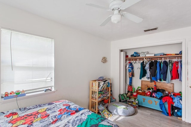 bedroom featuring a closet, ceiling fan, and hardwood / wood-style floors