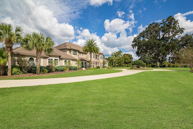 view of community featuring a yard