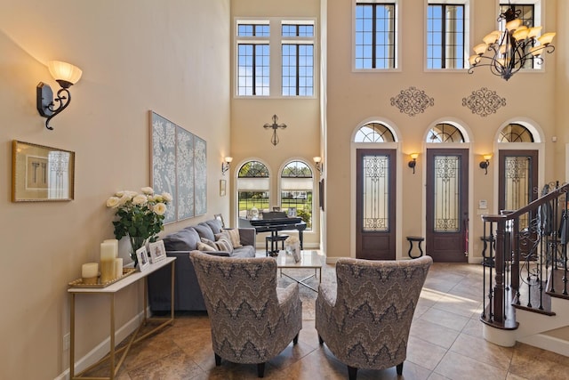 interior space featuring a high ceiling and an inviting chandelier