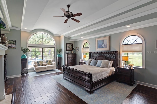 bedroom with ceiling fan, multiple windows, and dark hardwood / wood-style flooring