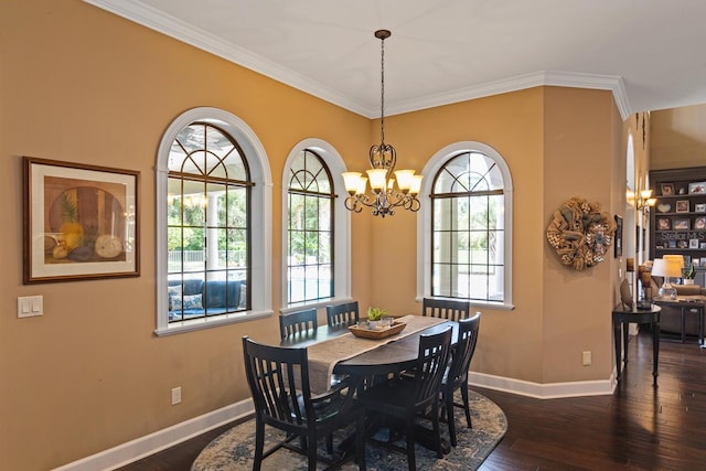 dining room featuring crown molding, a healthy amount of sunlight, a chandelier, and dark hardwood / wood-style floors