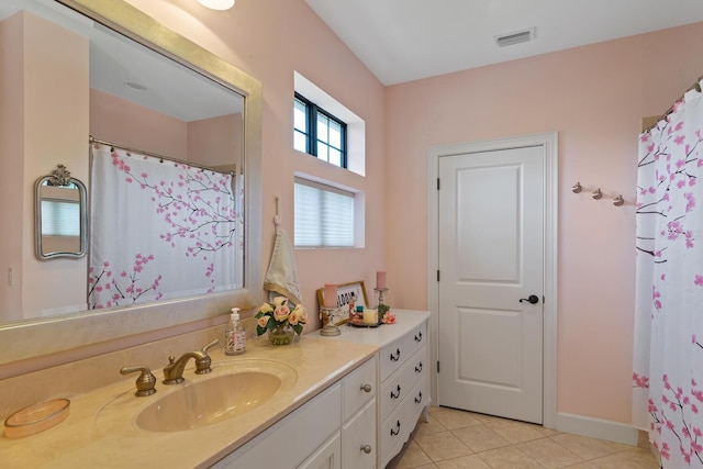 bathroom with vanity and tile patterned floors