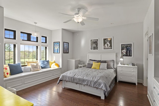 bedroom with dark wood-type flooring and ceiling fan