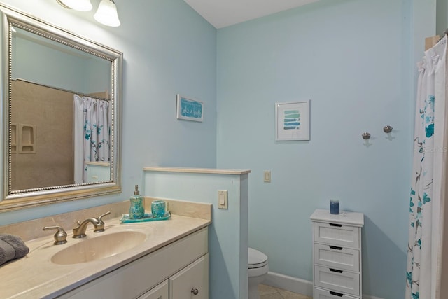 bathroom featuring vanity, toilet, and tile patterned flooring