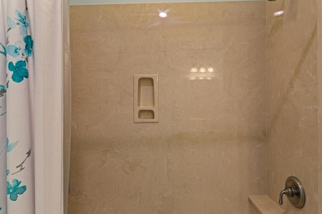 bathroom with a shower with shower curtain