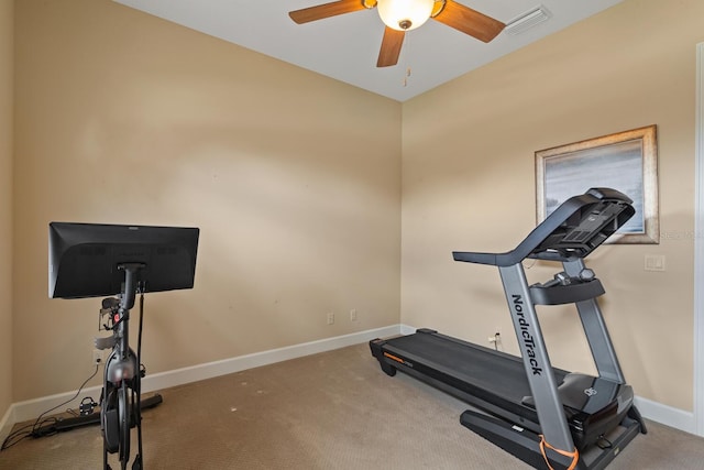 exercise room with ceiling fan and carpet floors