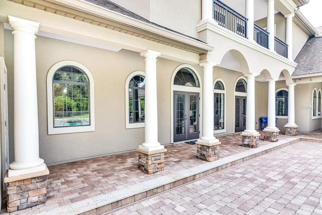 view of patio featuring a balcony