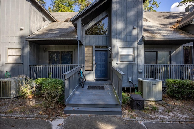 doorway to property featuring central AC unit