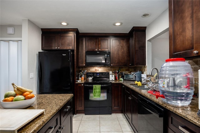 kitchen featuring light stone countertops, black appliances, sink, backsplash, and light tile patterned floors