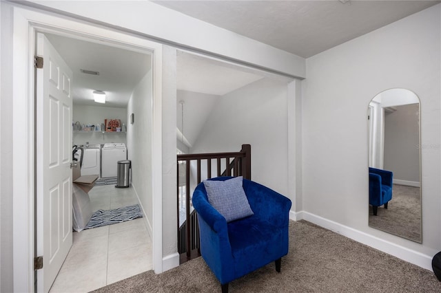 interior space featuring washer and dryer and light colored carpet