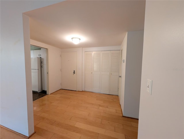 corridor featuring light wood-type flooring