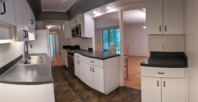 kitchen with white cabinets, sink, range with electric cooktop, and dark hardwood / wood-style flooring