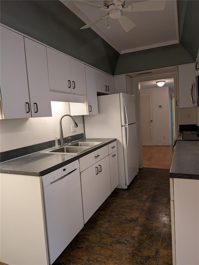 kitchen featuring sink, range, white dishwasher, white cabinetry, and ceiling fan