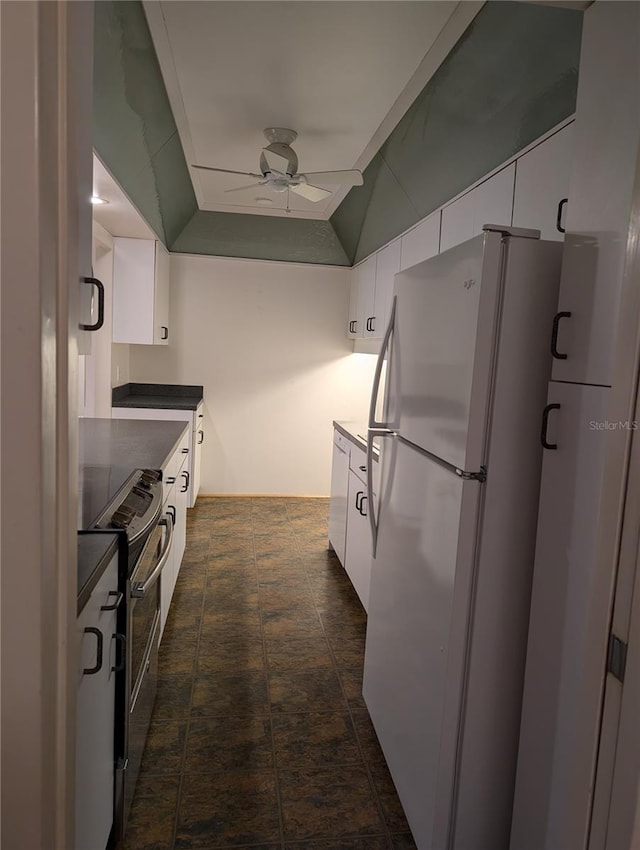 kitchen featuring white cabinets, white fridge, electric range, and ceiling fan