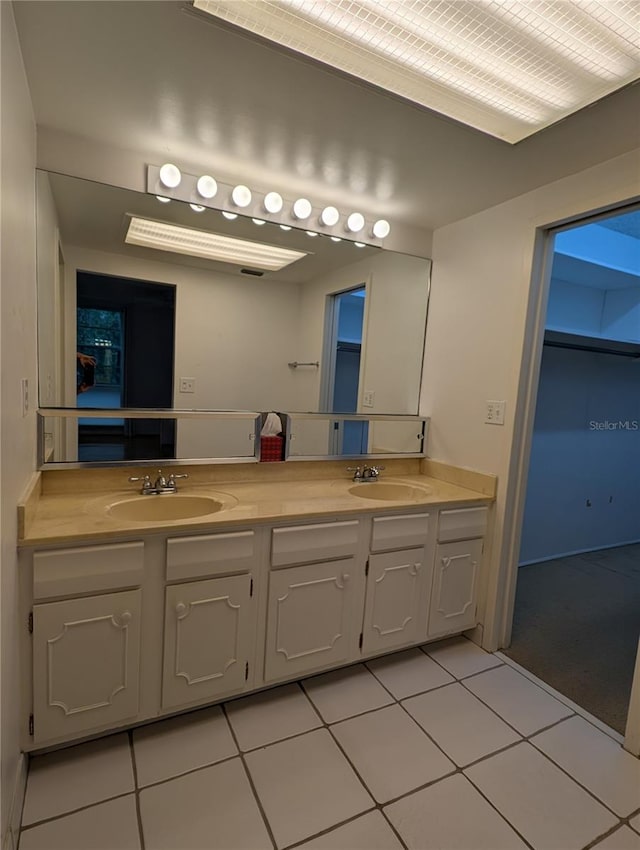 bathroom with vanity and tile patterned floors