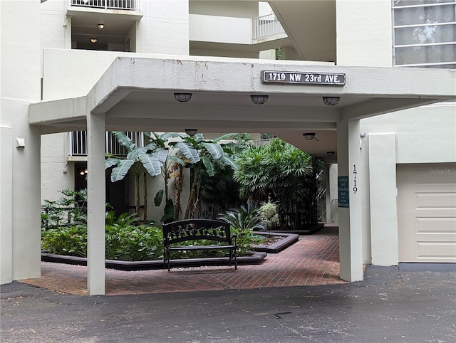 exterior space with a balcony and a garage