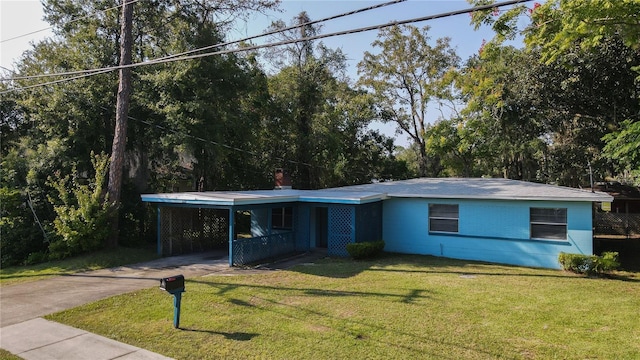 ranch-style home with a carport and a front yard