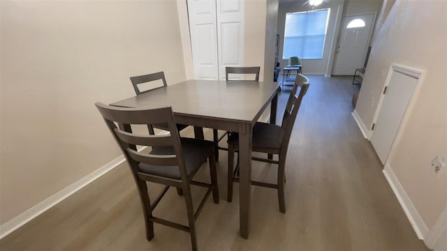 dining area with dark hardwood / wood-style floors