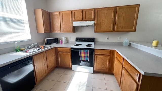 kitchen featuring black appliances, sink, and light tile patterned floors