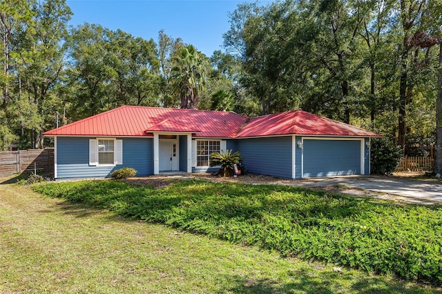 single story home with a front yard and a garage