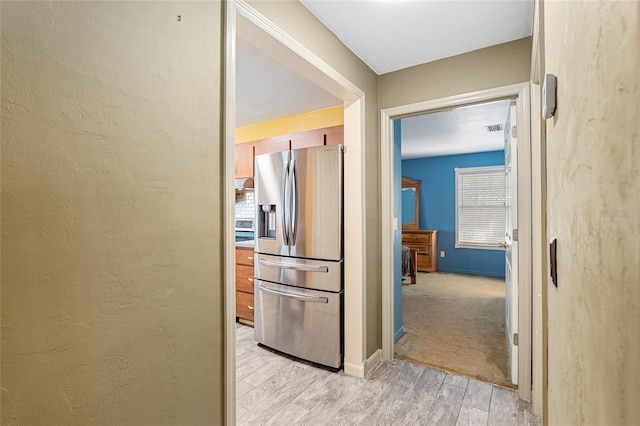 hall with light hardwood / wood-style flooring