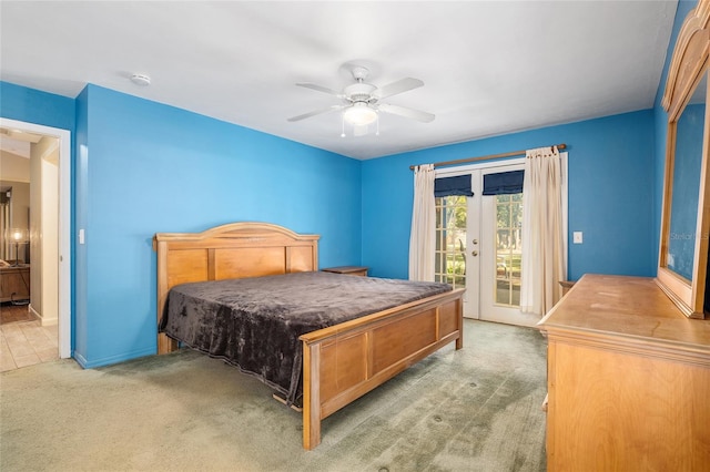 carpeted bedroom with access to outside, french doors, and ceiling fan