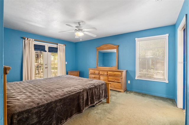 carpeted bedroom featuring access to outside, french doors, and ceiling fan