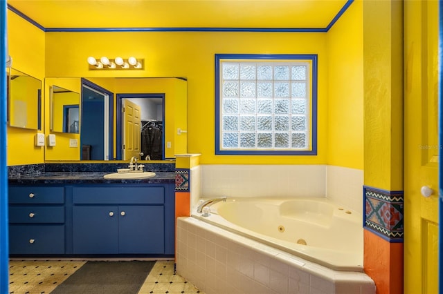 bathroom featuring vanity and tiled tub