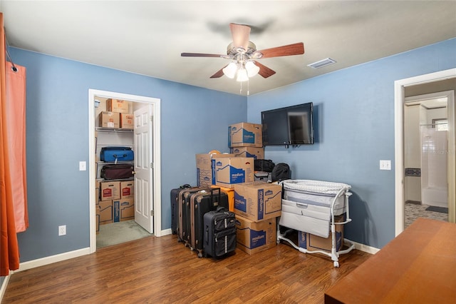 bedroom with hardwood / wood-style floors and ceiling fan