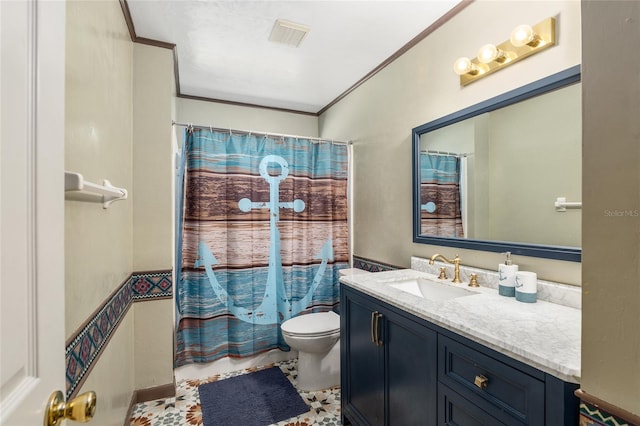 bathroom with vanity, toilet, and ornamental molding