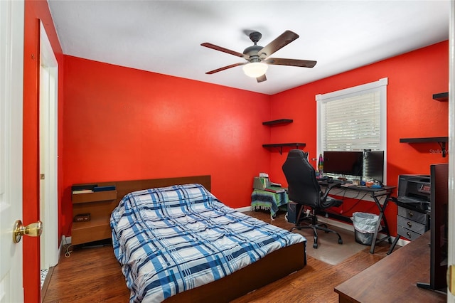 bedroom featuring ceiling fan and dark hardwood / wood-style flooring