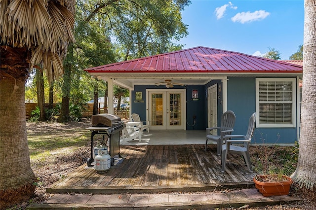 exterior space with french doors, a deck, and ceiling fan