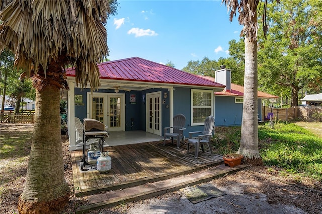 back of property featuring french doors and a deck