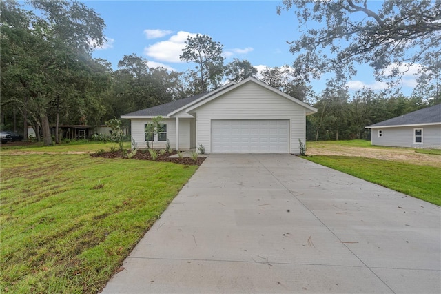 ranch-style home with a front yard and a garage