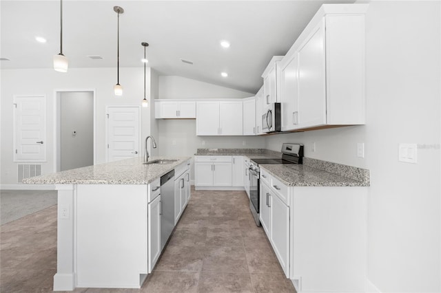 kitchen featuring lofted ceiling, an island with sink, white cabinetry, sink, and stainless steel appliances