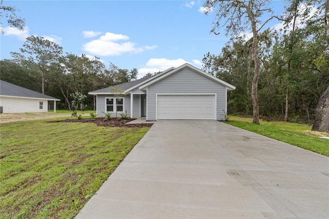 ranch-style house featuring a front yard and a garage