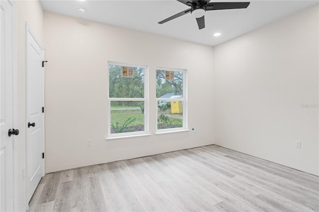 unfurnished room with light hardwood / wood-style floors and ceiling fan