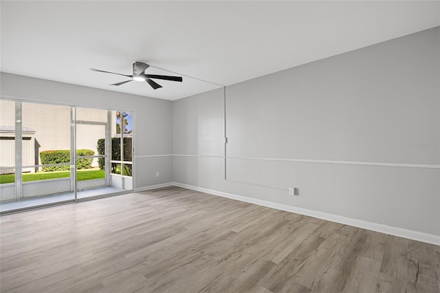 empty room featuring light hardwood / wood-style floors and ceiling fan