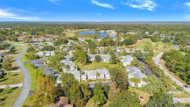 birds eye view of property with a water view, golf course view, and a residential view