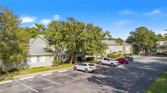 uncovered parking lot with a residential view