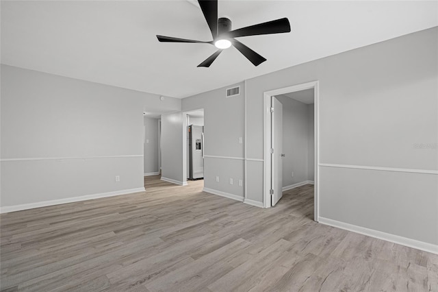 spare room featuring light hardwood / wood-style floors and ceiling fan