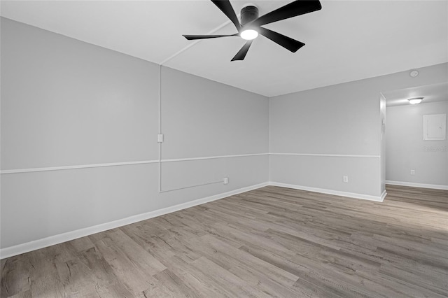 spare room with light wood-type flooring and ceiling fan