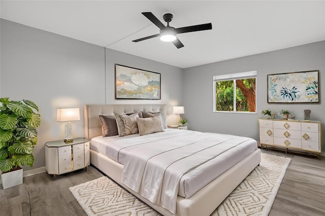 bedroom featuring ceiling fan and hardwood / wood-style flooring