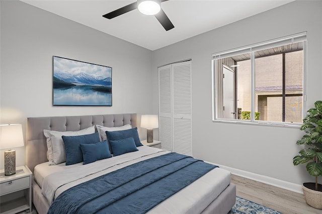 bedroom featuring a closet, ceiling fan, and light hardwood / wood-style floors