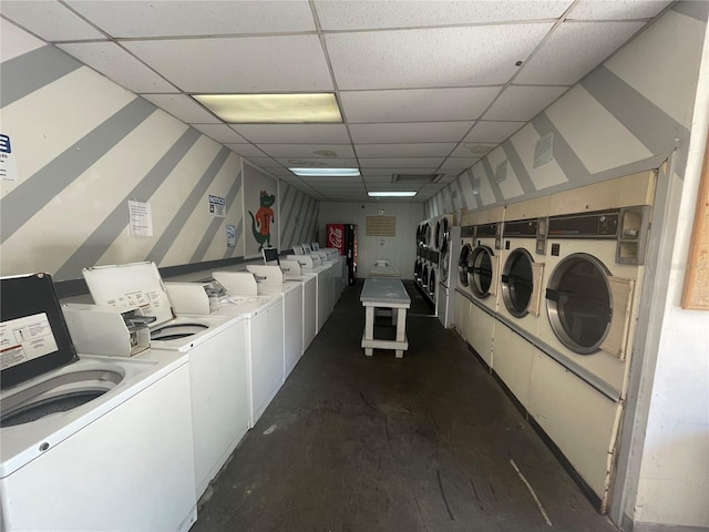 laundry room with dark wood-type flooring and washer and clothes dryer