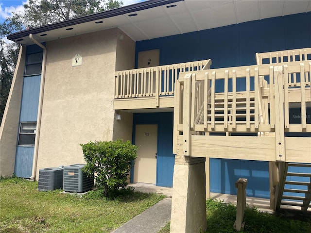 view of property with central air condition unit