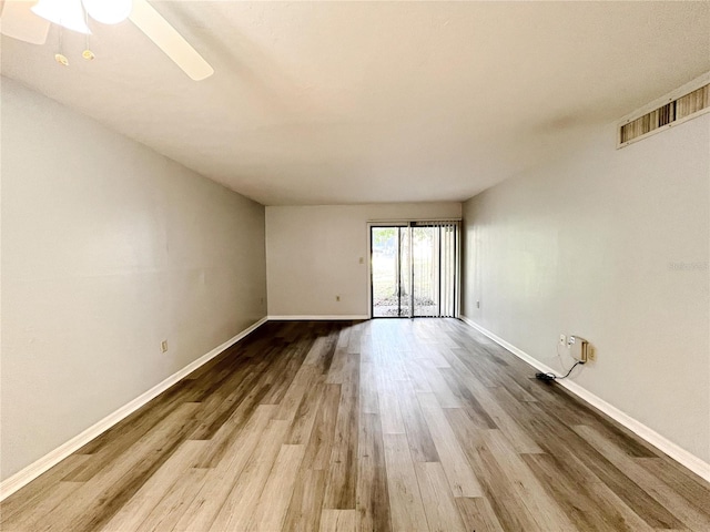 spare room featuring ceiling fan and light wood-type flooring