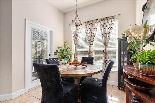 tiled dining room with a wealth of natural light